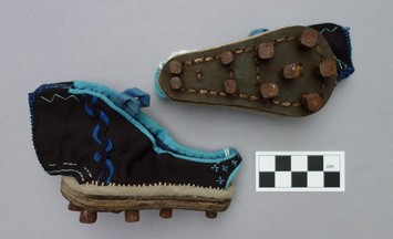 Pair of pattens with iron studs (cleats) worn over lotus shoes during bad weather (late 19th century; TRC 2014.0133a-b).  b