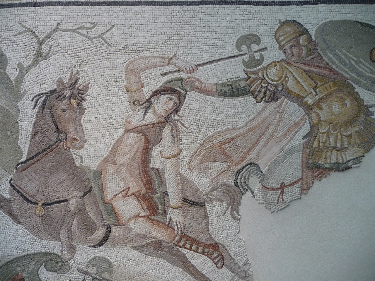 R. Mosaic of Amazon with double headed axe 4th century CE Turkey. Now in the Louvre