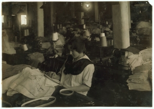 Photograph showing Helen Whitty, at work with hand embroidery.  Boston 1917.