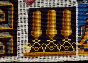 Detail of a 19th century English sampler with gros point stitch.