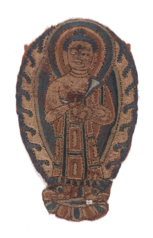 Textile fragment with the embroidered figure of a Buddha. Dunhuang, 8th - 9th centuries AD.