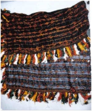 A black, bridal head covering from the Siwa oasis, Egypt.