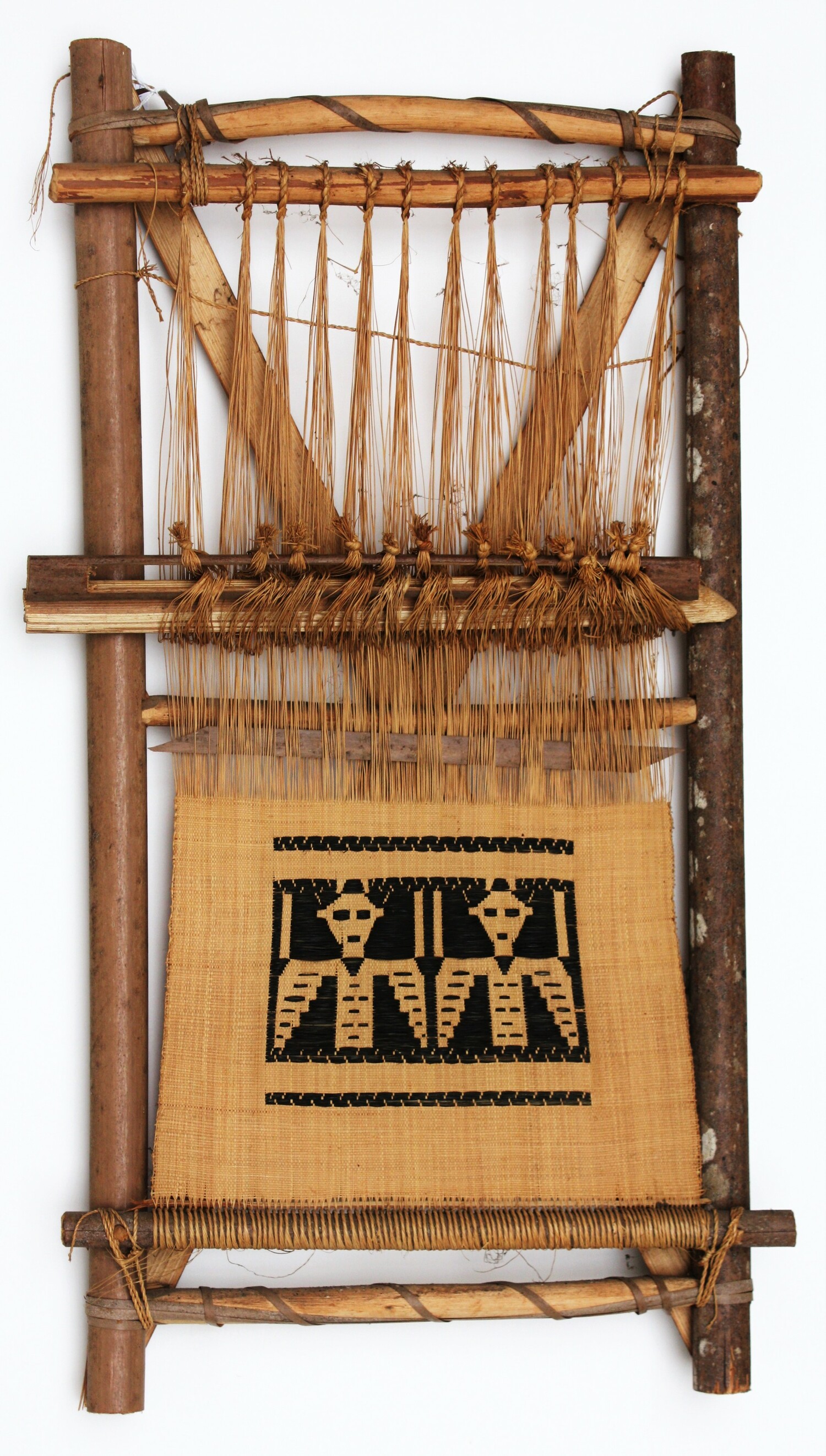 Single heddle loom from Cameroon for making raffia bags (TRC 2011.0132).