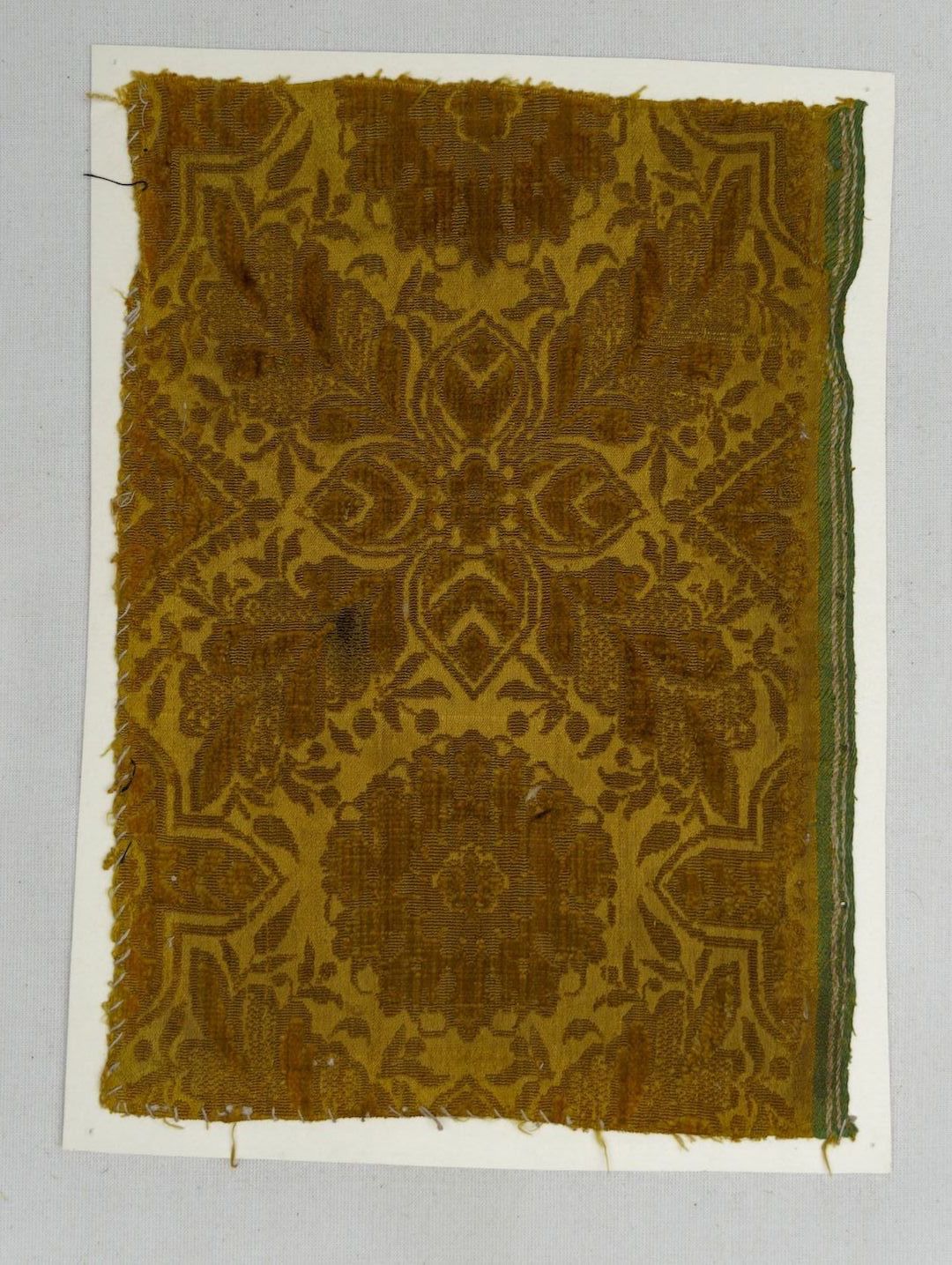 Fig. 4. Early 17th century velvet, showing the extra  stripes along the selvedge indicating the quality of the cloth (TRC 2011.0376).