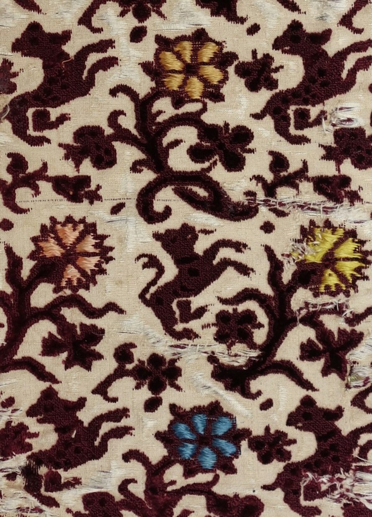 Mid-17th century ciselé velvet sample with huinting dogs, from Italy (TRC 2011.0385).