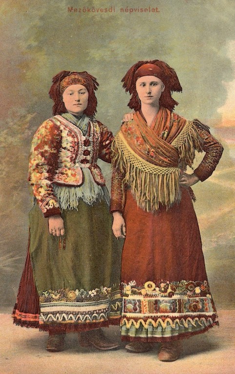 Fig. 10. A coloured postcard from Hungary, with two women wearing regional dress, including embroidered shawls and aprons (TRC 2017.2288).