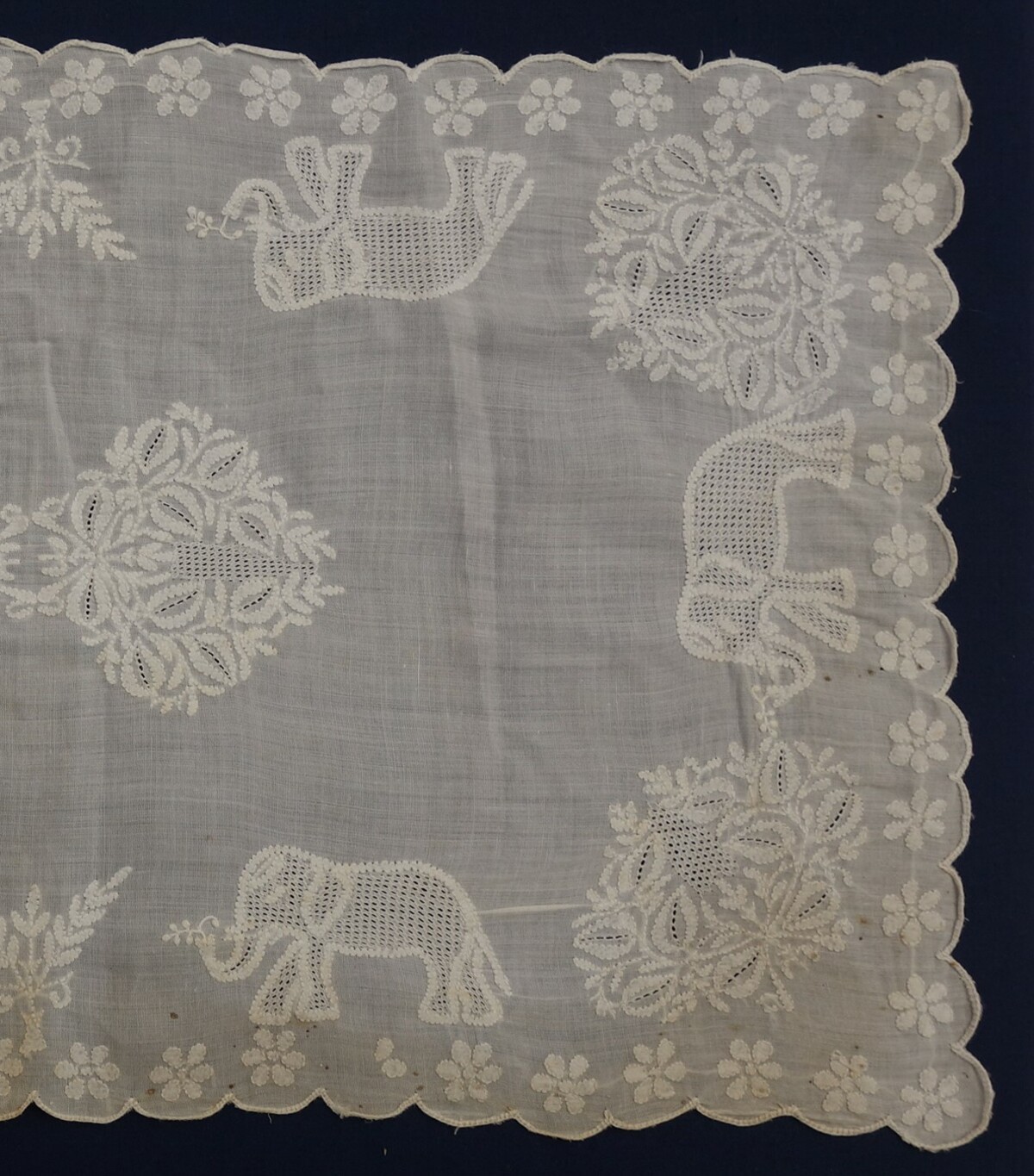  Detail of a mat from Lucknow, northern India, mid-20th century, with shadow work created by closed herringbone stitch and pulled thread work (TRC 2018.2780). 