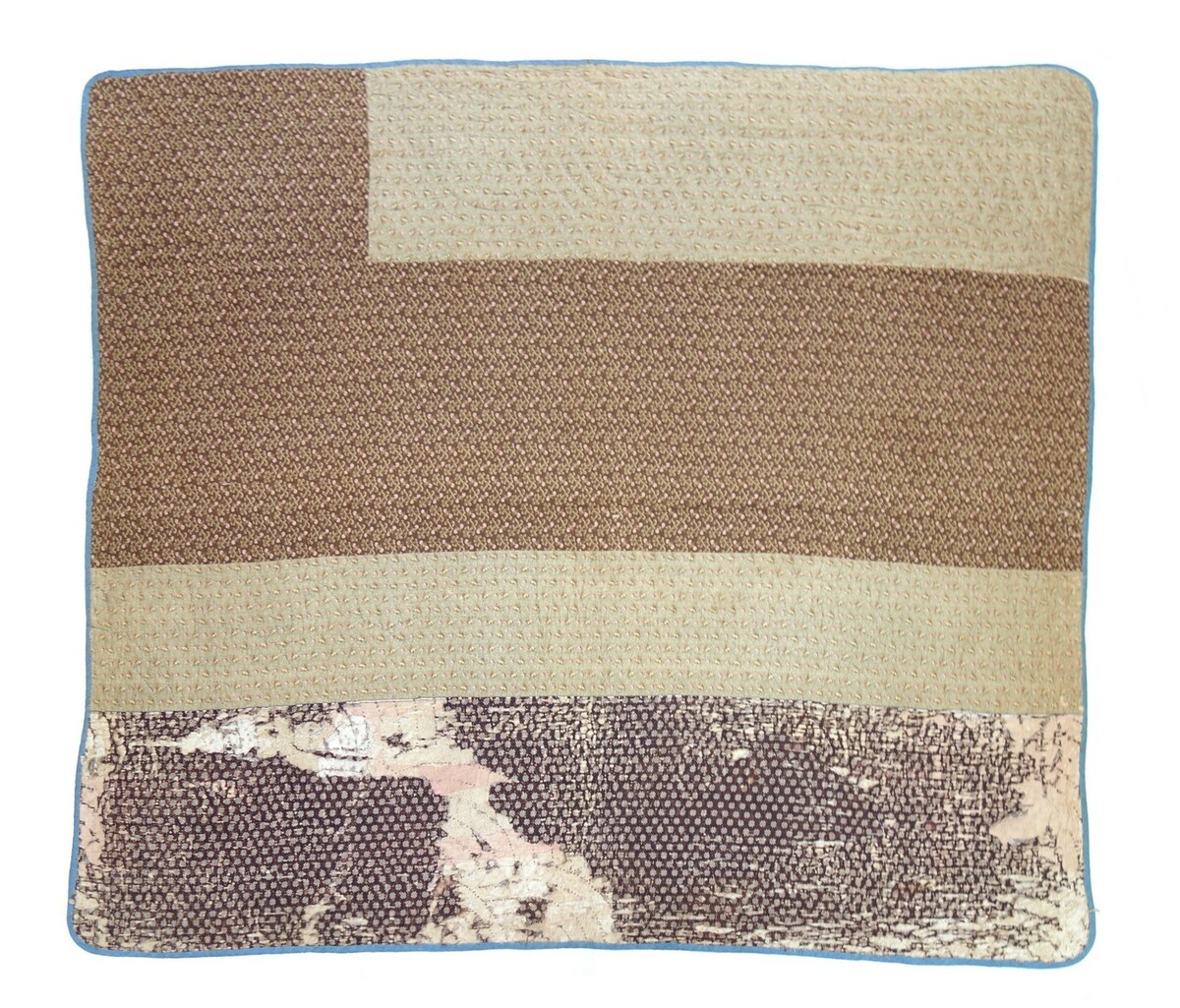 Detail of Chinese Coin quilt, North Carolina, USA, c. 1900 (TRC 2019.2229). At the bottom of the quilt are traces of another quilt, reused as batting.