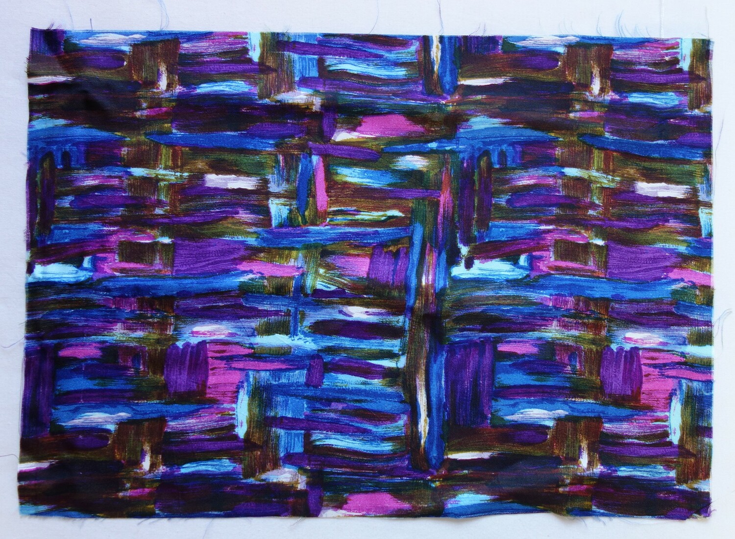 Fig. 2. Cloth sample with an abstract 'painted' design of blobs and thick lines in dark purple, pink, dark blue, mid-blue and light blue, brown and white. Europe, 1950s (TRC 2020.1190