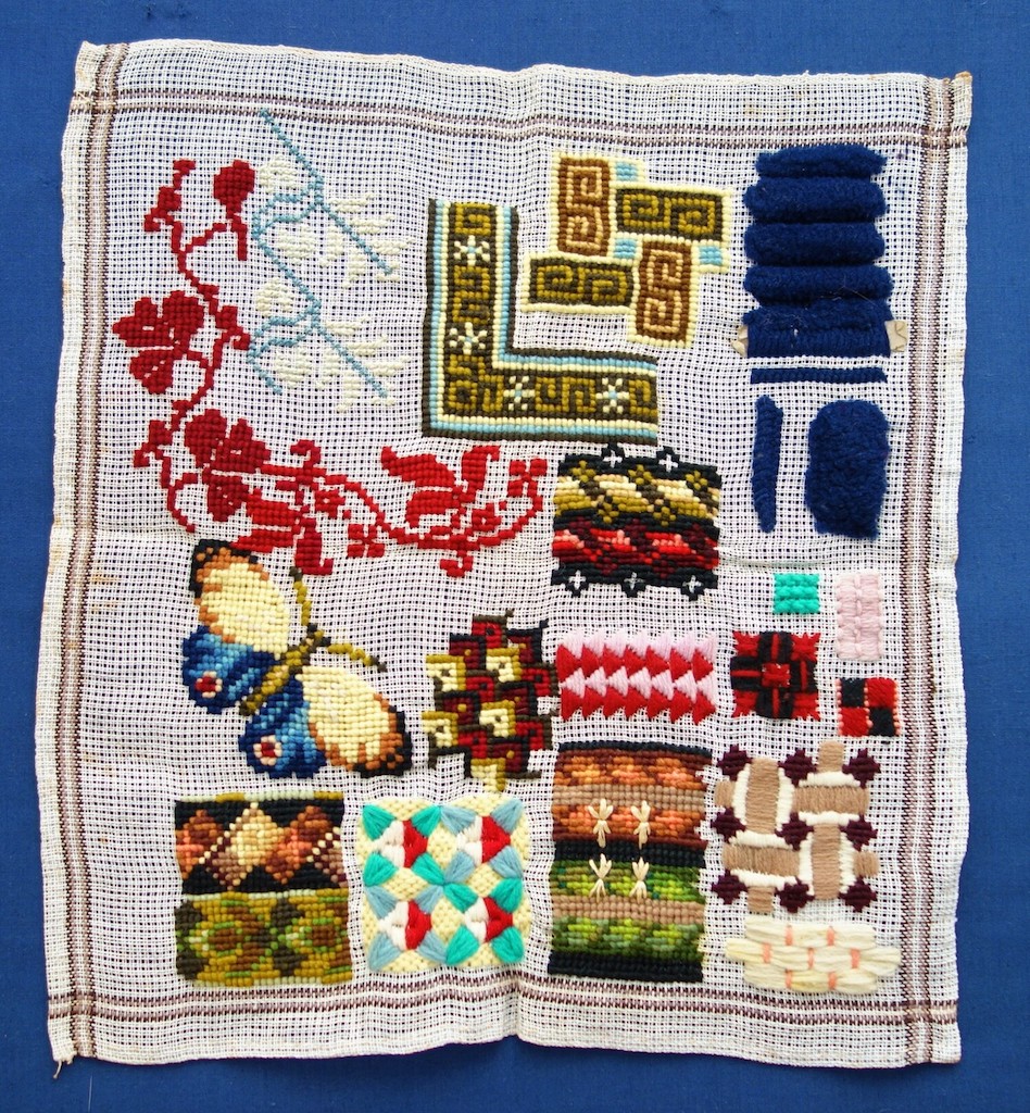 School sampler from the 1870's with Berlin wool work style motifs, The Netherlands (TRC 2020.2395).