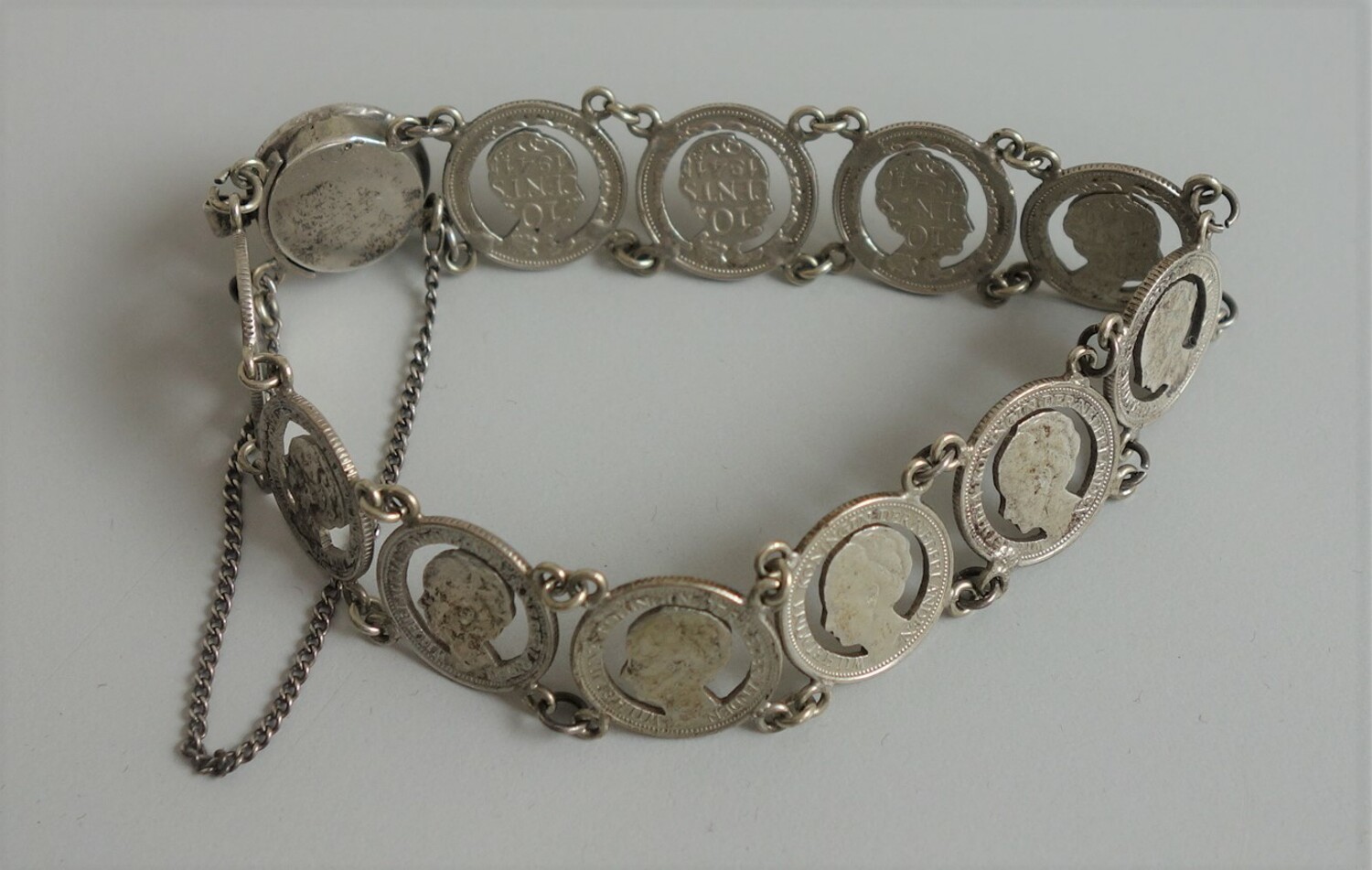 Bracelet made from Dutch silver 10 cent coins minted in Utrecht, 1941, and during the war made into a patriotic bracelet (TRC 2020.2714).