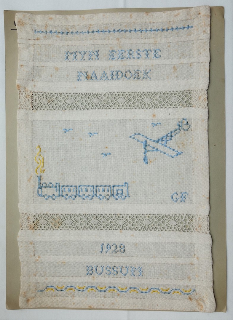 First sampler ('naaidoek') worked by G. Filbry in 1928 (TRC 2020.3838a).