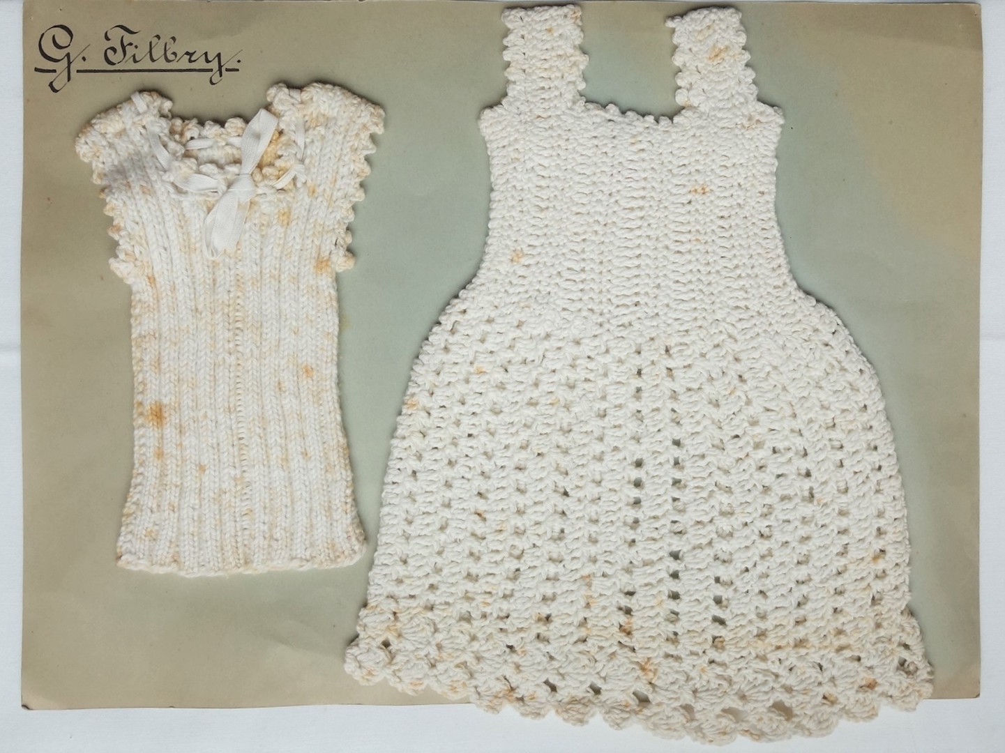 Knitted miniature vest and petticoat, worked by G. Filbry, between 1928 and 1930 (TRC 2020.3838f).