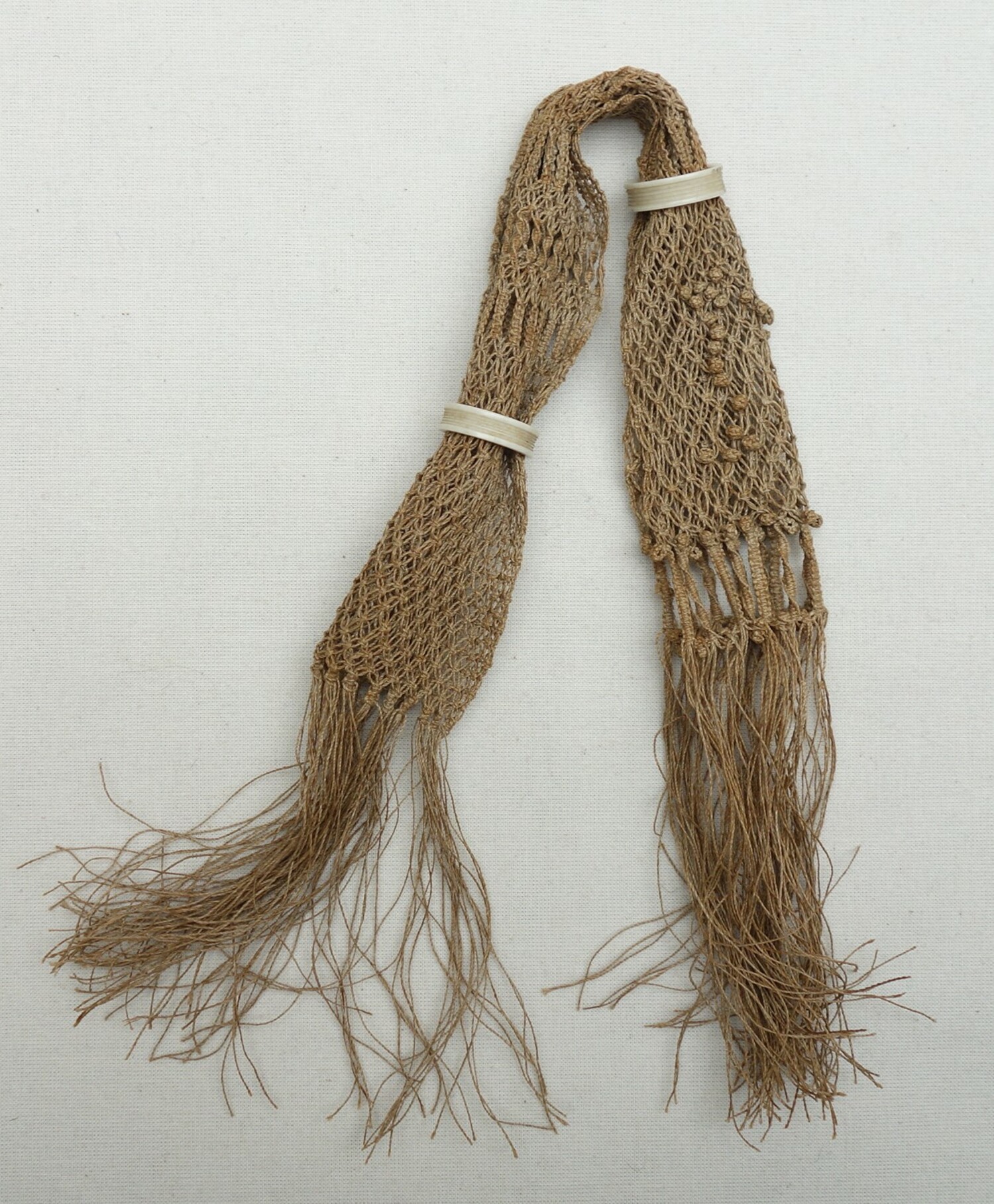 Miser's purse from Europe with two ivory rings, late 19th century (TRC 2021.2665).