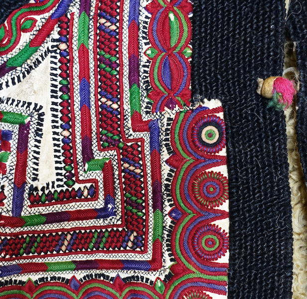Detail from an embroidered waistcoat of Ukrainian/Romanian origin (mid-20th century, TRC 2022.0390).
