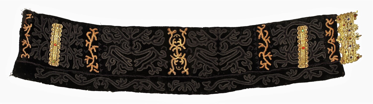 Black velvet belt with beading, passementerie, embroidery, and applied ornate buckle, from the Xhubleta region, Albania, mid-20th century (TRC 2022.1028).