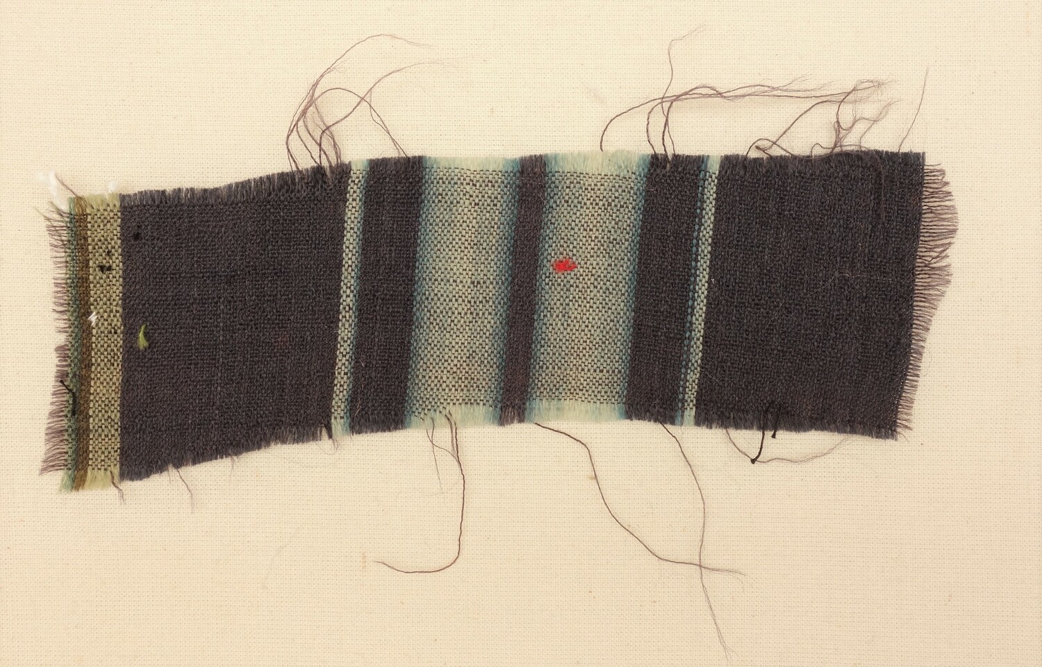 Sample of worsted cloth (stuff) with shaded (ombré) light blue stripes alternating with dark blue stripes of varying widths. Norwich, 18th century (TRC 2023.0876).