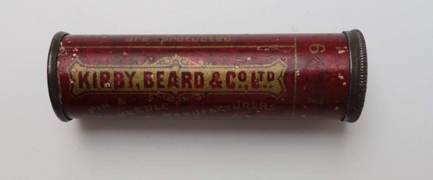 Round red metal case containing needles. The packaging has the text "KIRBY, BEARD & C0., LTD. Pin & needle manufacturers." UK, 1890-1900 (TRC 2025.0671).