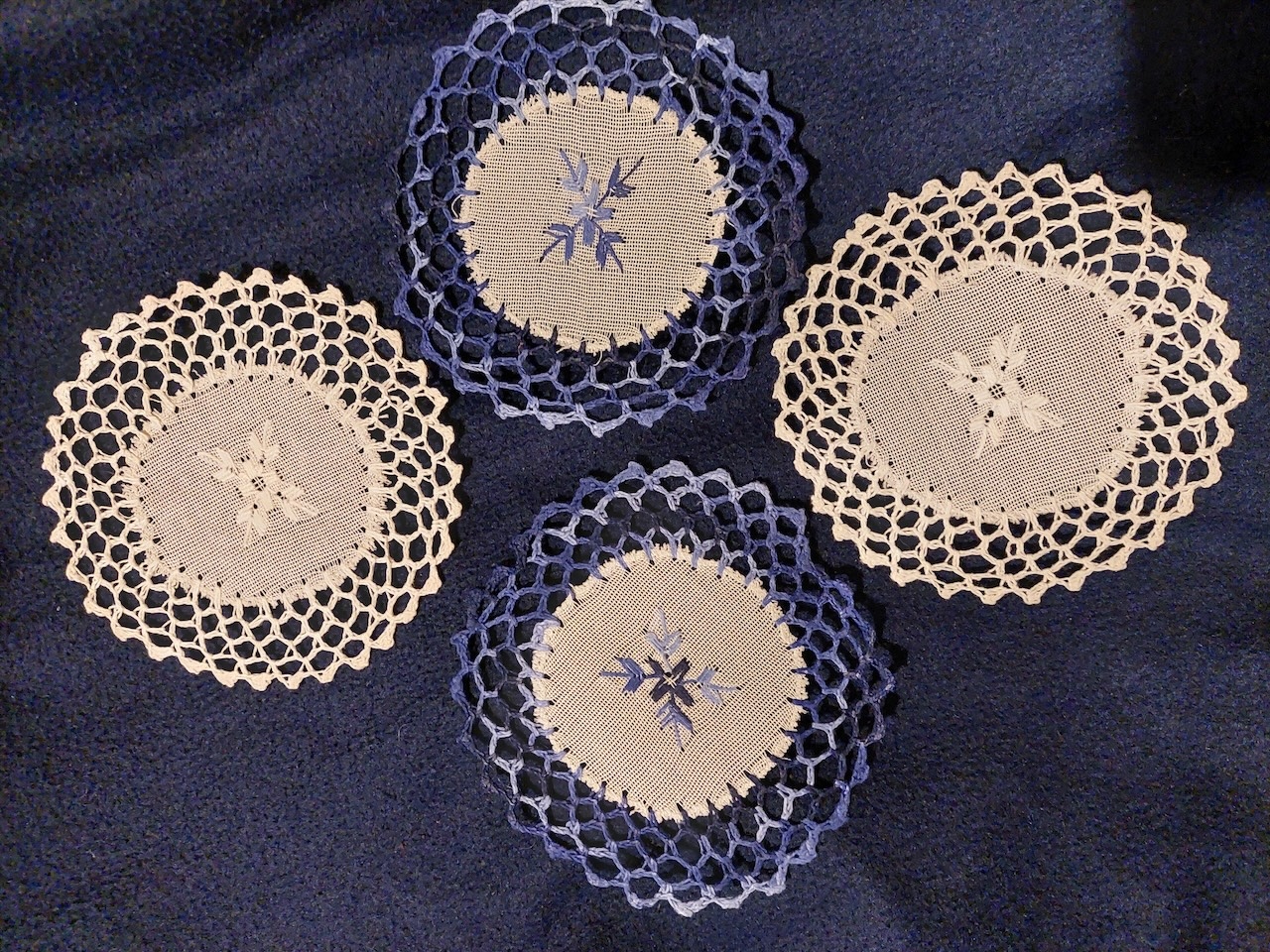 Four blue and white nanduti lace coasters, cotton, 2025, Paraguay. Photo: Shelley Anderson.