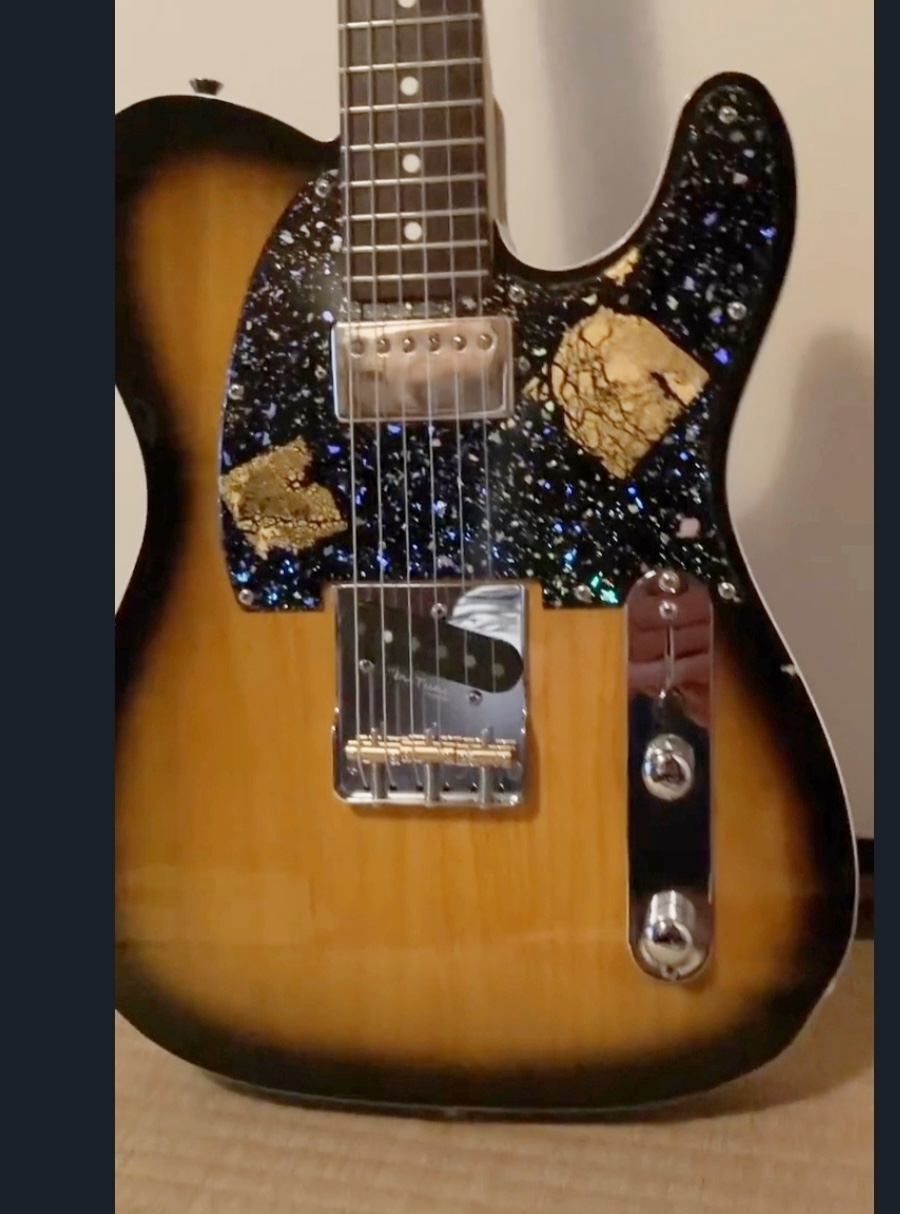 Fig. 7. The guitar of Riku, the son of Masaru Matsui, decorated with haku art by Matsui.