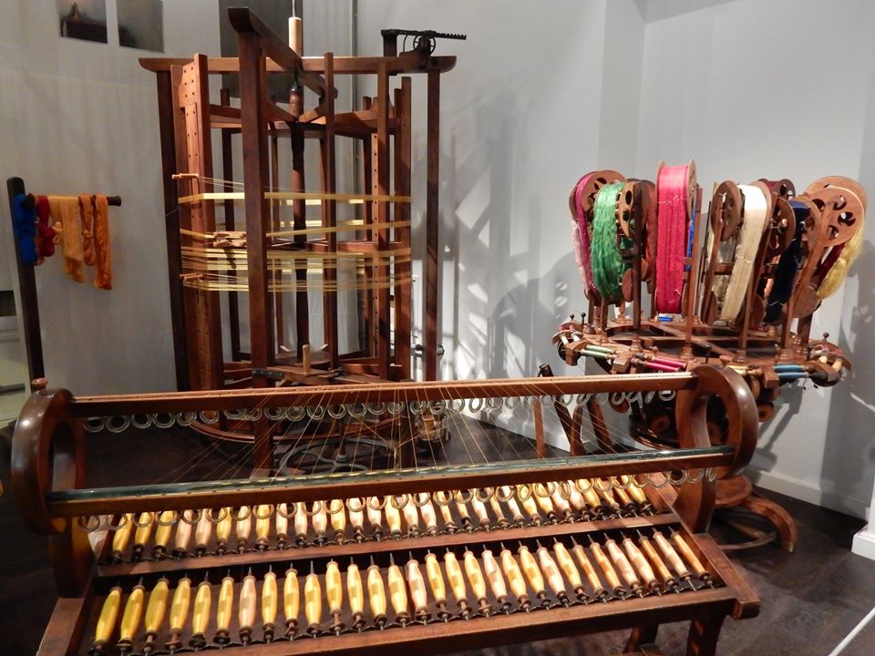 Spools of silk and a winding mill, to prepare a warp for weaving, Maison des Canuts, Lyons. Photograph: S. Anderson.