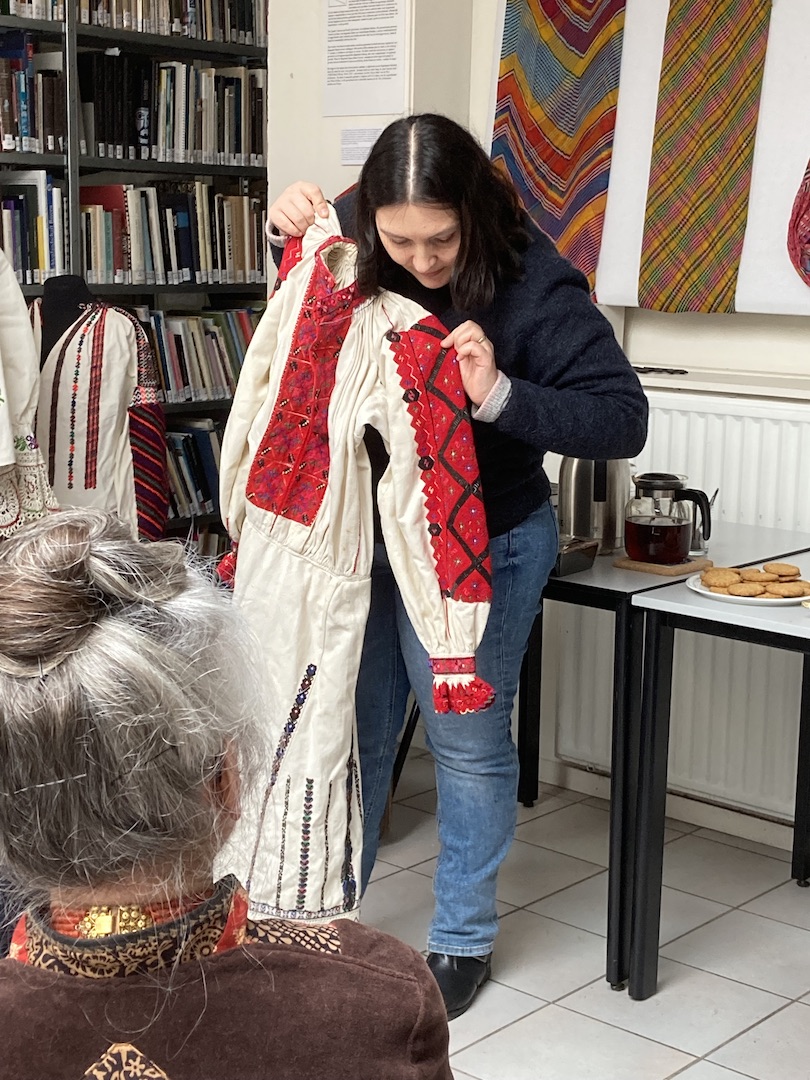 Monica Brinza showing a Romanian embroidered dress from the TRC collection. Romanian Blouse Day, 8 April 2023. Photograph Maria Linkogle.