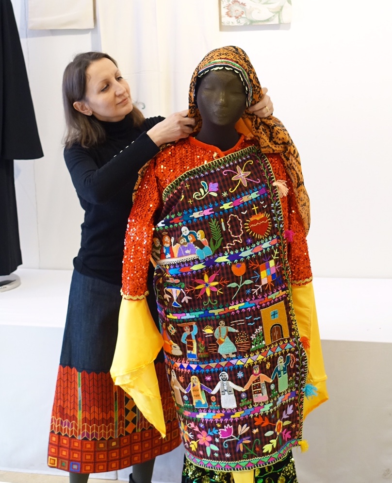 A charuka commissioned by the TRC from a Christian community in northern Iraq. The garment is being processed by Fatima Abbadi, who teaches Jordanian, Palestinian and Syrian embroidery and dress at the TRC.