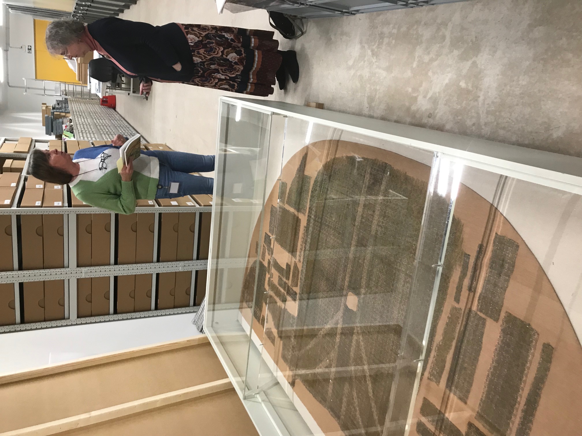 Greet Verschatse and author in the Trezoor in Kortrijk, Belgium, discussing the chasuble in the foreground, attributed to Thomas Becket. Photograph by Willem Vogelsang.