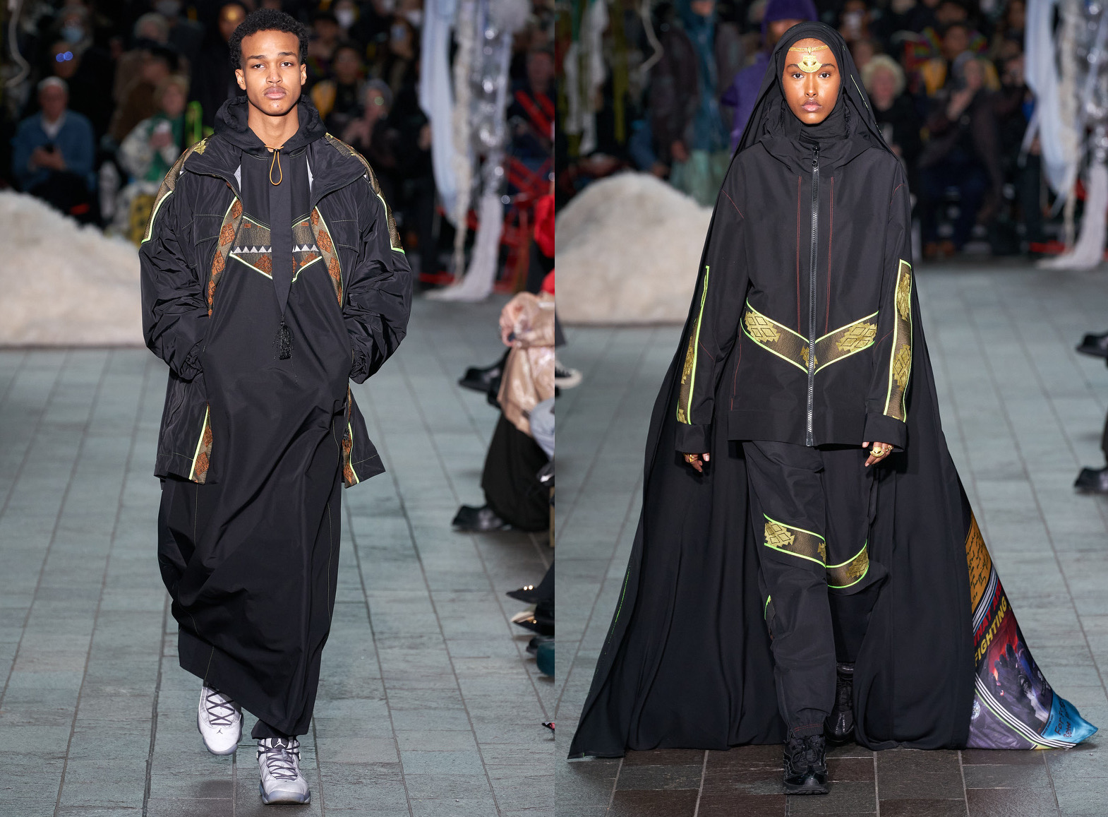 Two models showing part of Kazna Asker's collection during London Fashion Week (18-22 February).