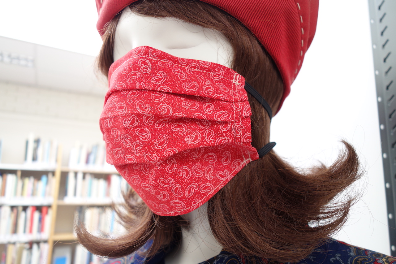 Mannequin with face mask, decorated with Paisley motifs. Photograph by Gillian Vogelsang.