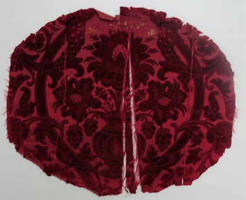 Early 19th century chair back made of red silk figured velvet (TRC 2011.0388).