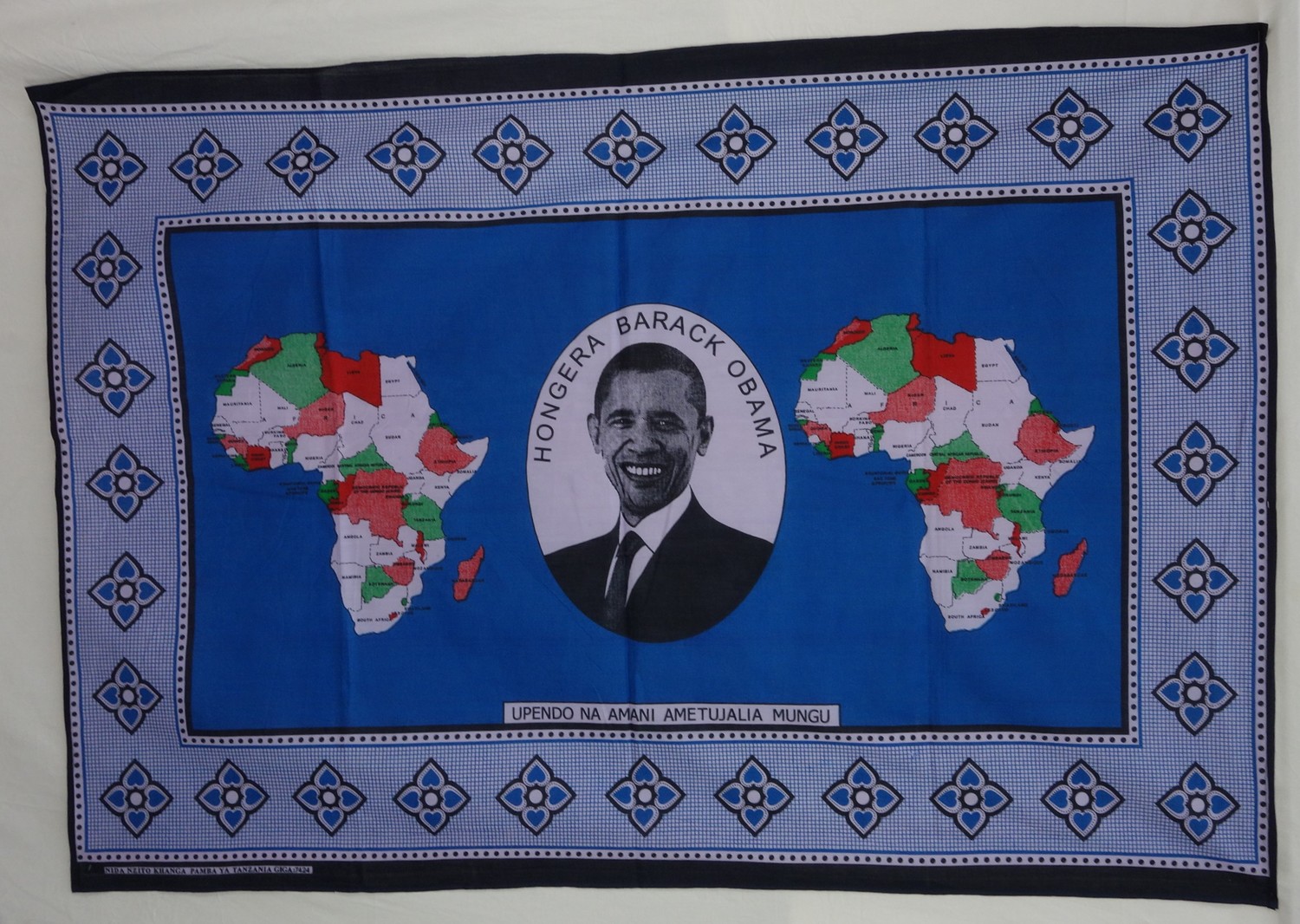 Kanga from Kenya, acquired in 2010, with a central design showing former USA President Obama (TRC 2013.0132).