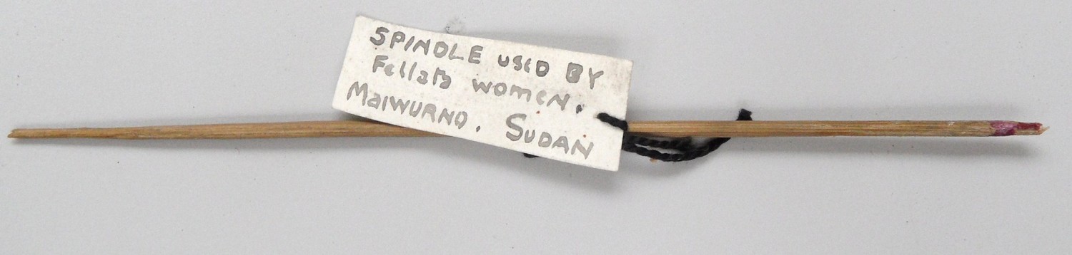 Nubian spindle shaft, 1920s, collected by Grace Crowfoot, with label with her handwriting (TRC 2014.0780).
