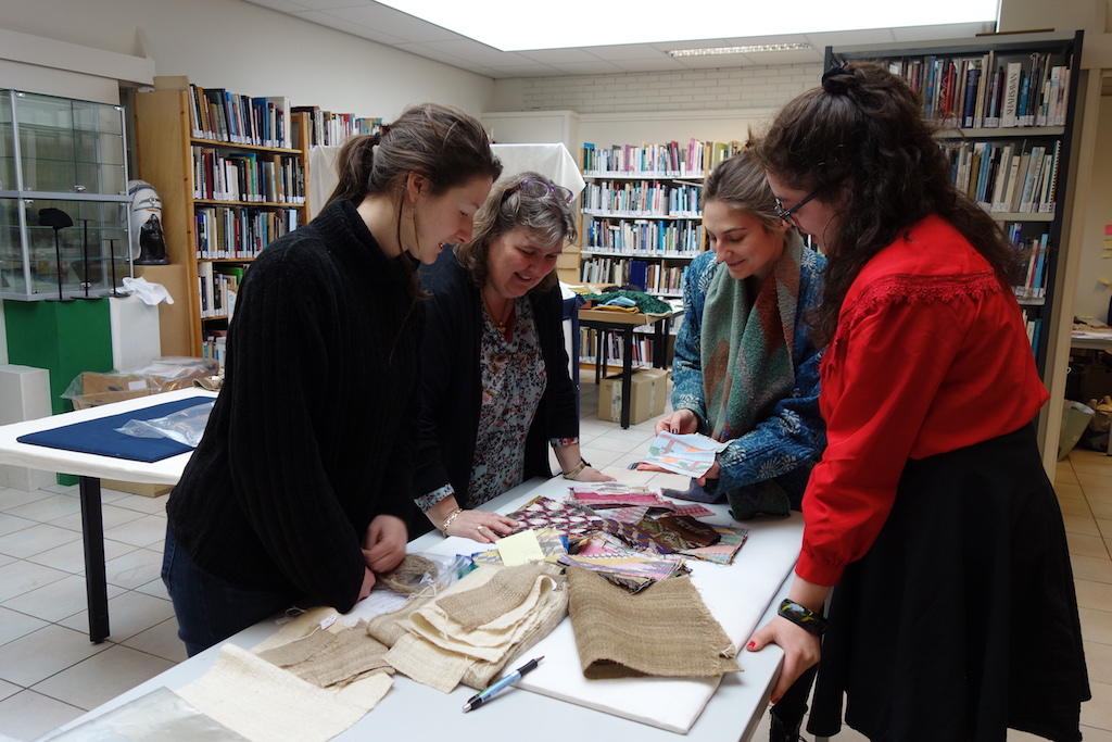 TRC colleagues going through the recent arrival of the Nepalese textiles.