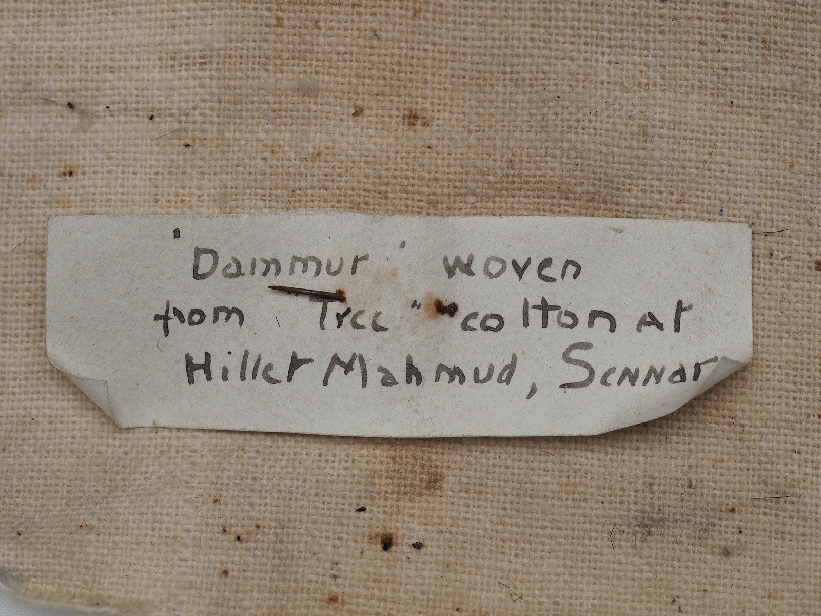 Label that goes with the 'Dammur' textile from Sudan.