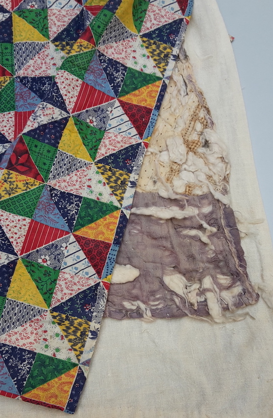 Early 20th century American quilt, with a mid-19th century quilt hidden inside.