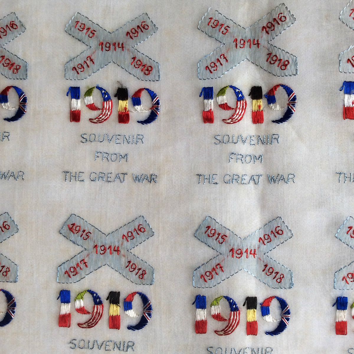 Part of a sheet with embroidered designs waiting to be cut out for the WW I postcards. The war ended in November 1918, before these designs (dated 1919) could be used. TRC collection