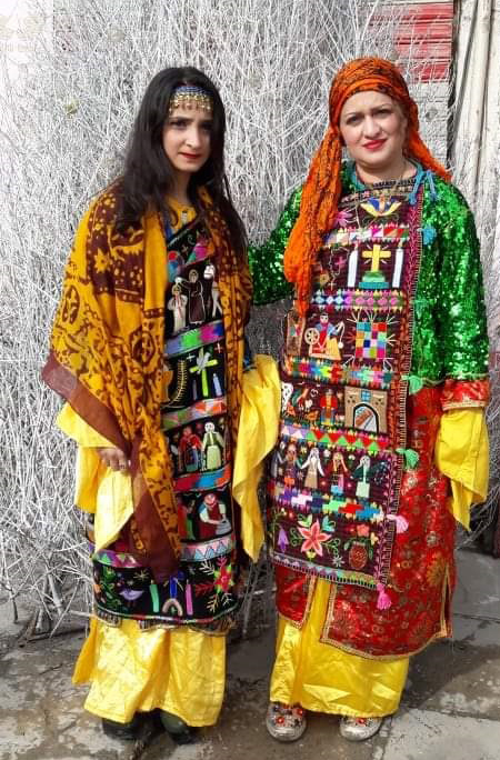 Suzan Sukari (right) and her daughter (left), wearing modern charugas.